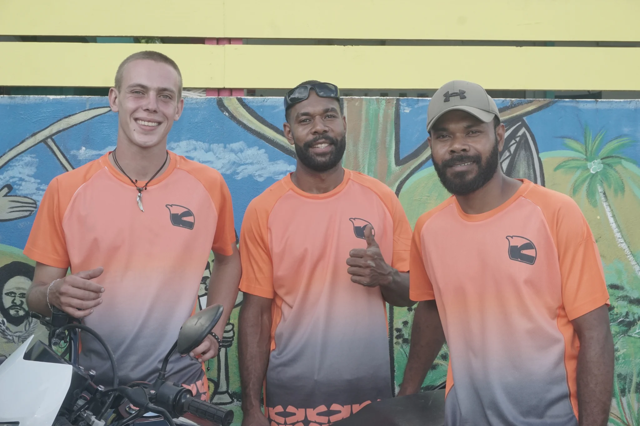 A photo of the Kaikai KOKO team including two delivery drivers and the founder